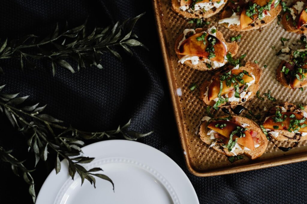 overhead shot of peach and burrata crostinis